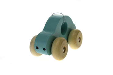 Green wooden toy car by Kaper Kidz, simple and eco-friendly, designed for children to play and enjoy.