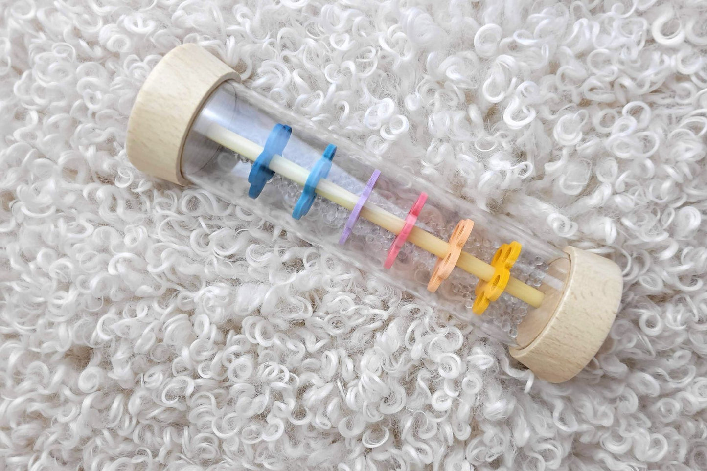Wooden rainmaker toy from Calm & Breezy by Kaper Kidz featuring French lavender scent and natural wood finish.