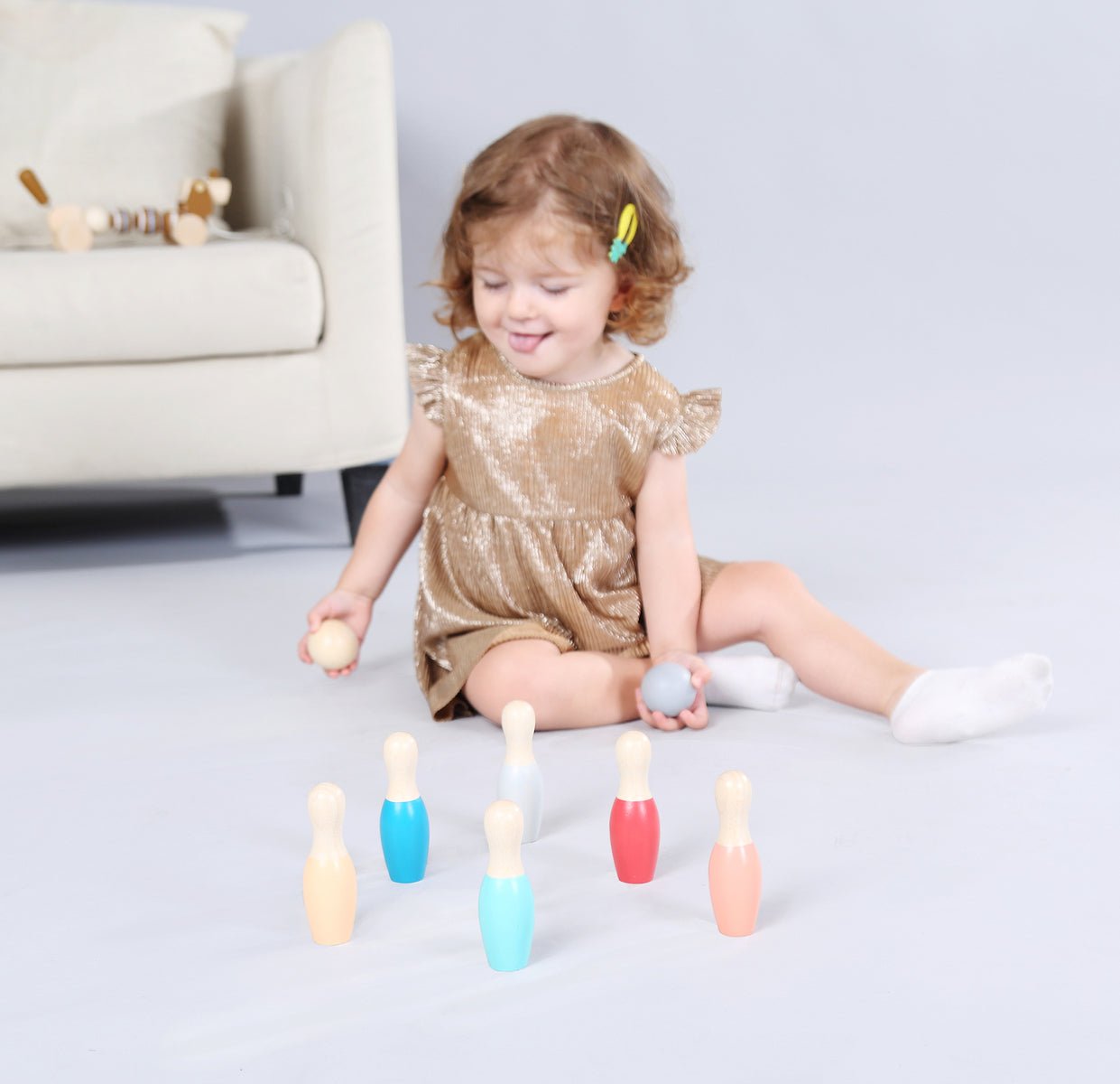 Kaper Kidz wooden bowling set with colorful bottom pins and ball for kids' indoor play.
