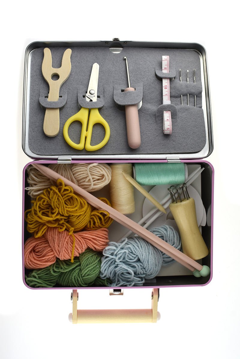 Kaper Kidz Calm & Breezy Knitting Kit in a compact tin case, includes yarn, needles, and instructions for beginner knitting projects.