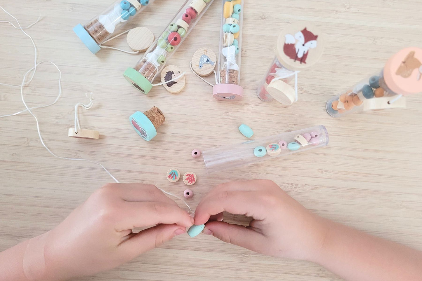 Diy wooden bracelet featuring sea and woodland animal charms by Kaper Kidz for kids' craft activity.