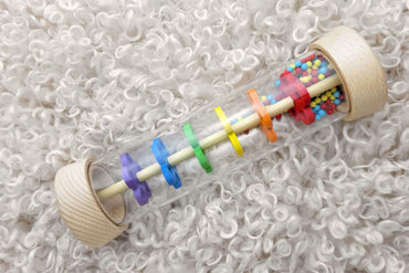 PRICE FOR ONE WOODEN RAINMAKER RATTLE IN CLEAR TUBE - Bamboo Sprout