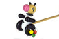 Wooden push-along cow toy by Kaper Kidz, featuring a natural wood finish and colorful details for young children.