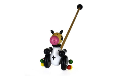 Kaper Kidz push along wooden cow toy for toddlers, featuring a smooth finish and sturdy handle for easy walking support.