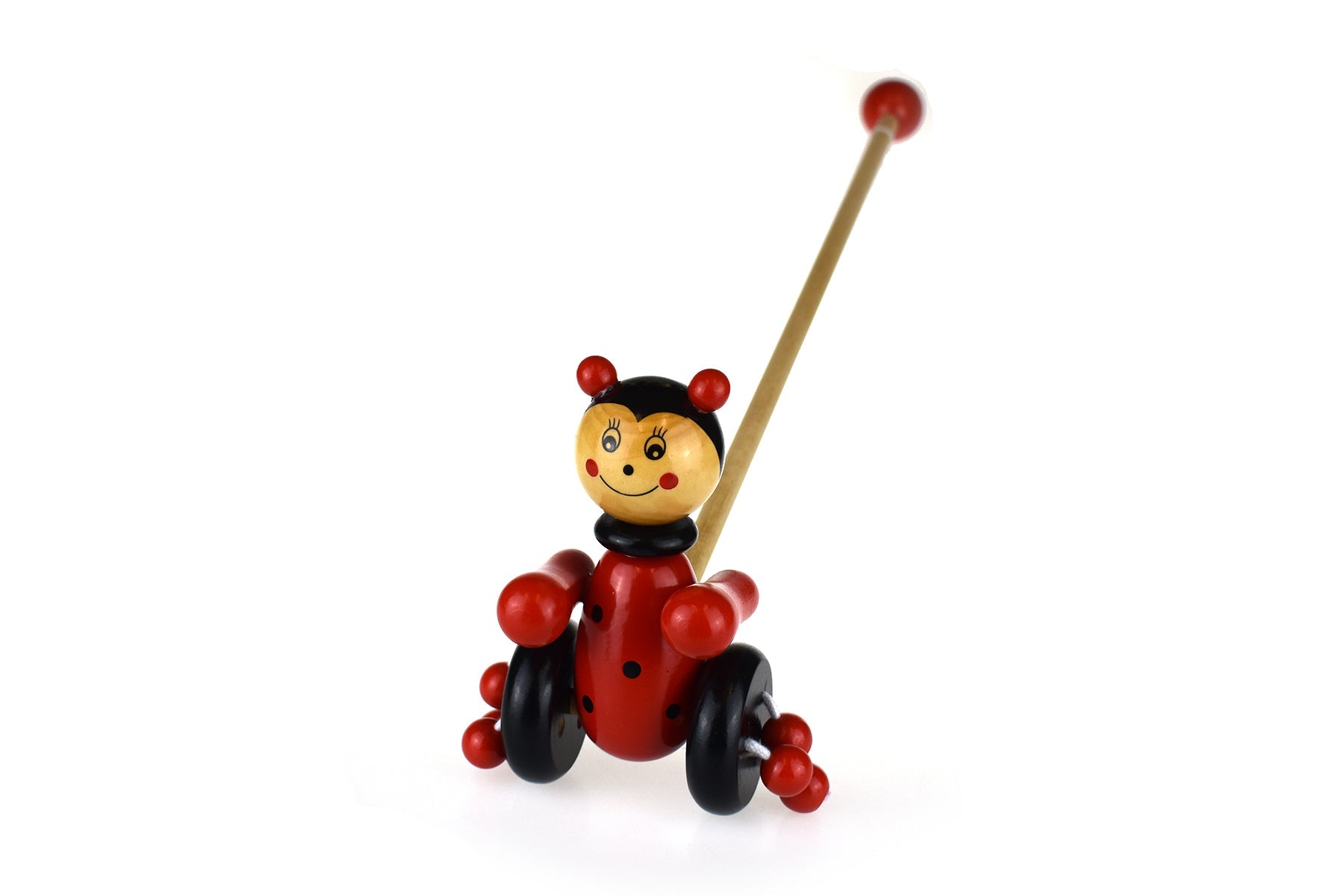 Kaper Kidz wooden ladybird push-along toy with red body, black spots, and wooden handle for toddlers to pull and play.