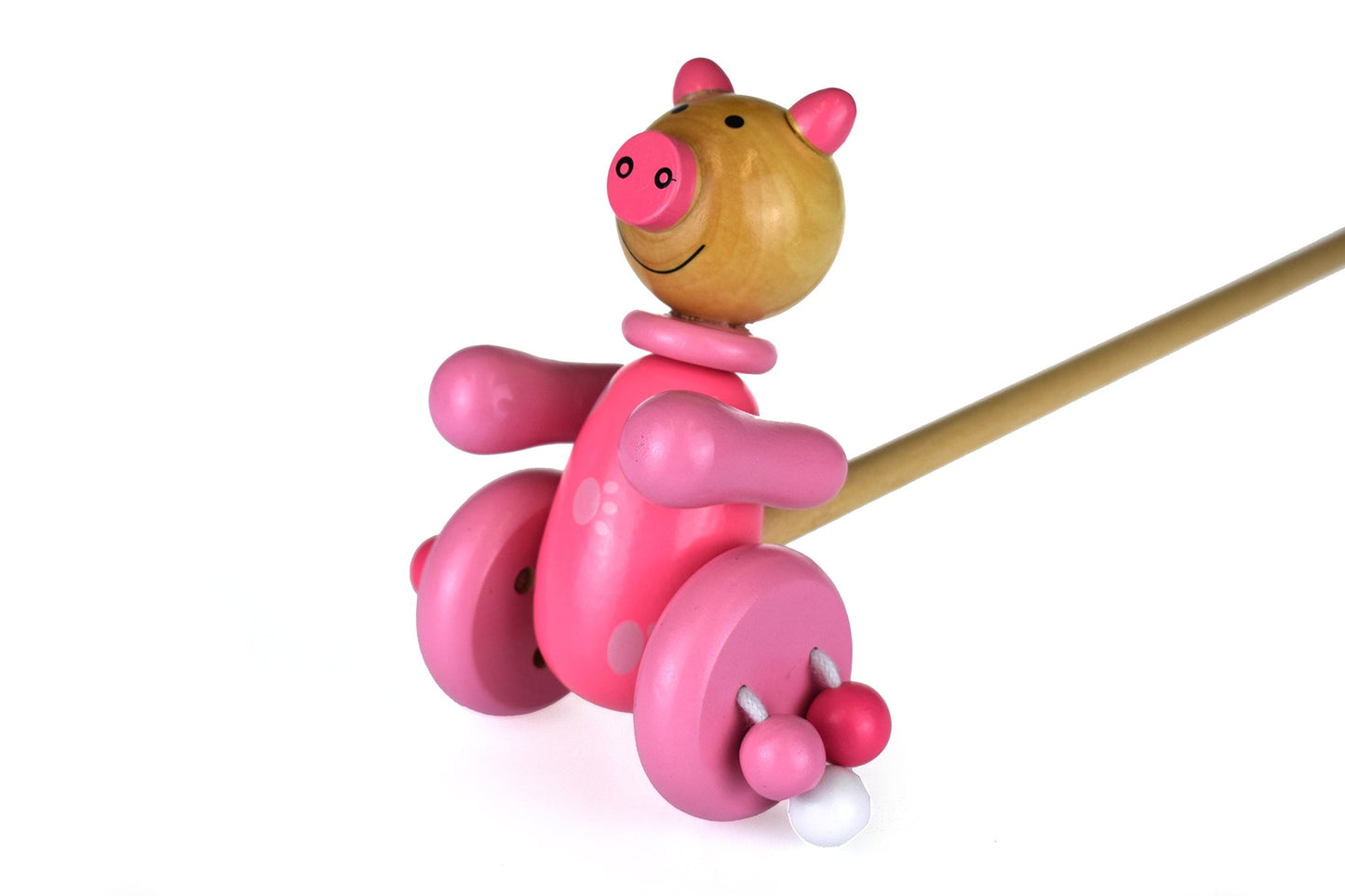 Push along wooden pig toy by Kaper Kidz, featuring a cute pig figure with wheels for young children's play.