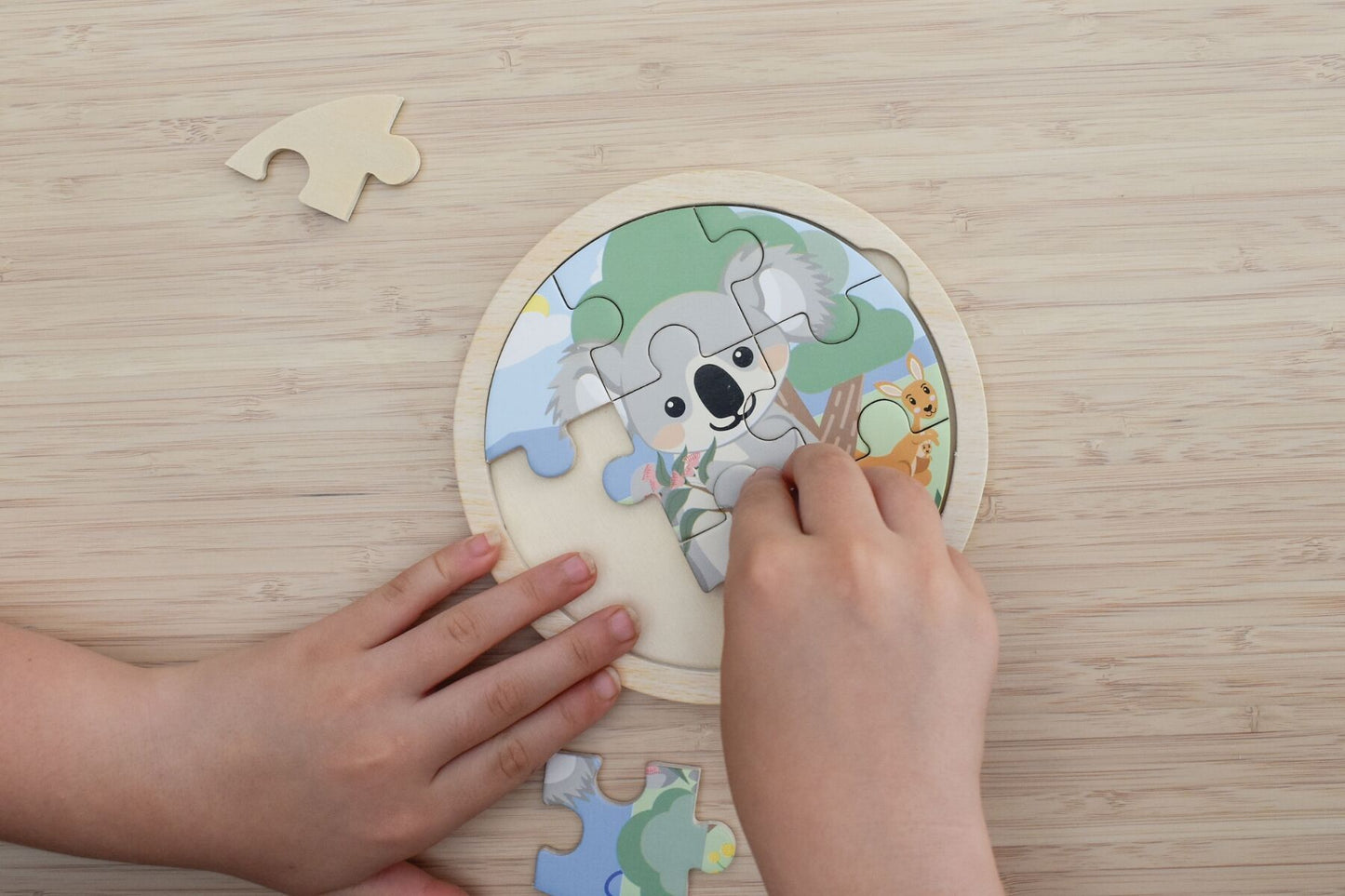 Wooden 9-piece Koala Dream jigsaw puzzle by Kaper Kidz featuring a cute koala illustration for children.