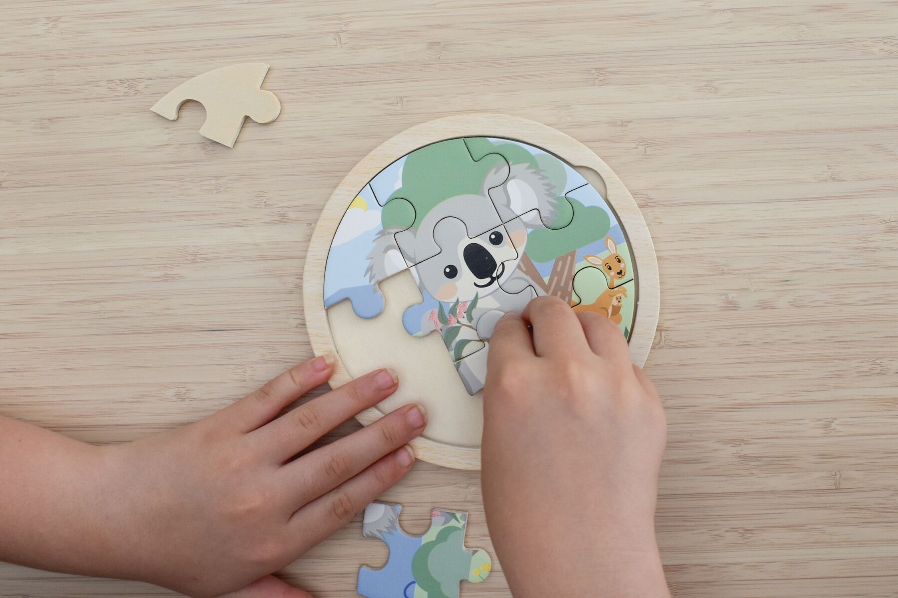 Wooden 9-piece Koala Dream jigsaw puzzle by Kaper Kidz featuring a cute koala illustration for children.